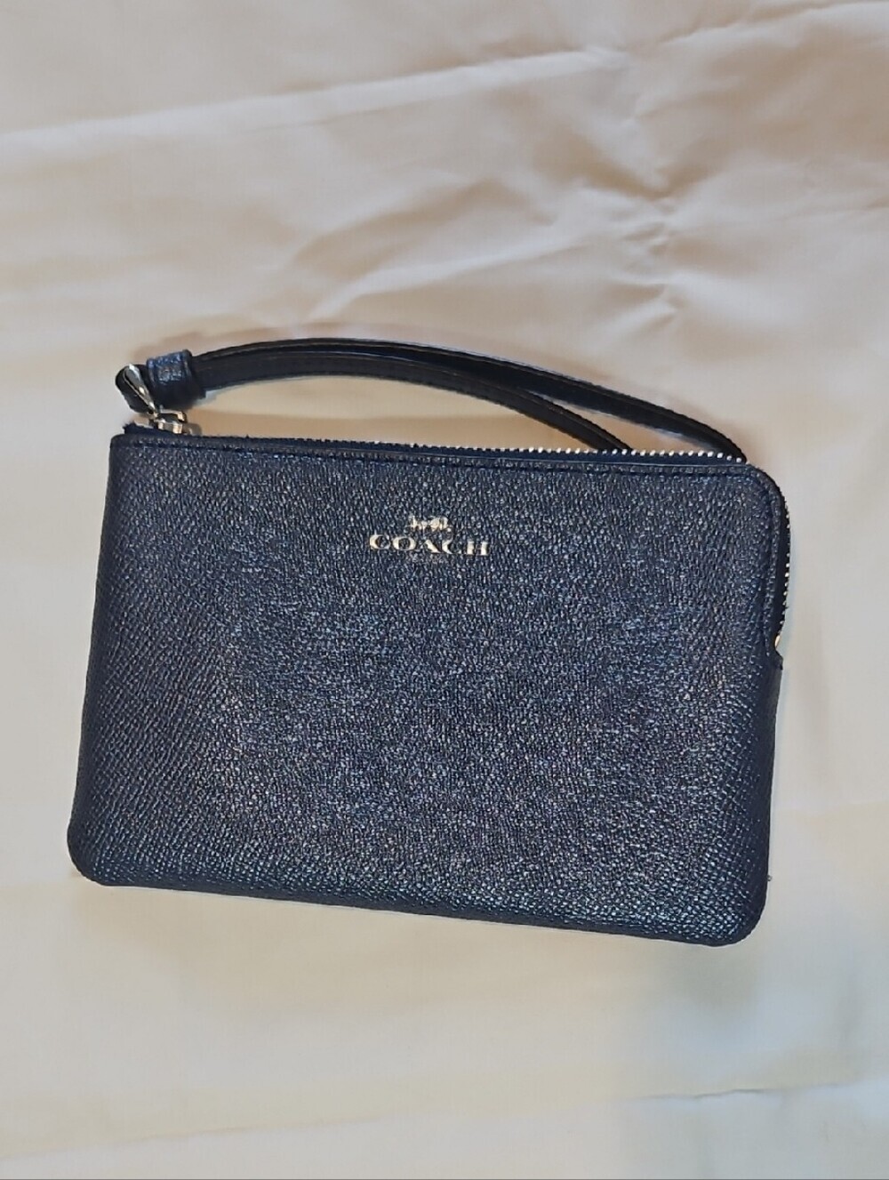 Coach Navy Pebbled Leather Wristlet with Silver Logo